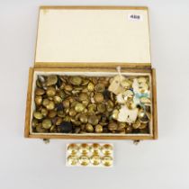 An extensive box of military buttons.