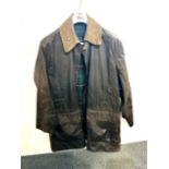 A gent's Barbour waxed coat, shoulder W. 48cm.