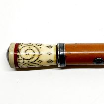 A 19thC walking stick with a studded bone handle L. 90cm.