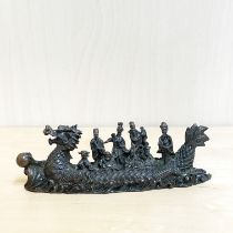 A Chinese bronze figure of a dragon boat with eight immortals L. 16cm.