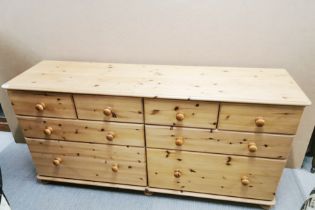 An eight drawer pine chest, 160 x 80 x 45cm.