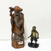 A Chinese carved wooden figure Shou Lao H. 35cm. Together with an oriental bronze figure of a