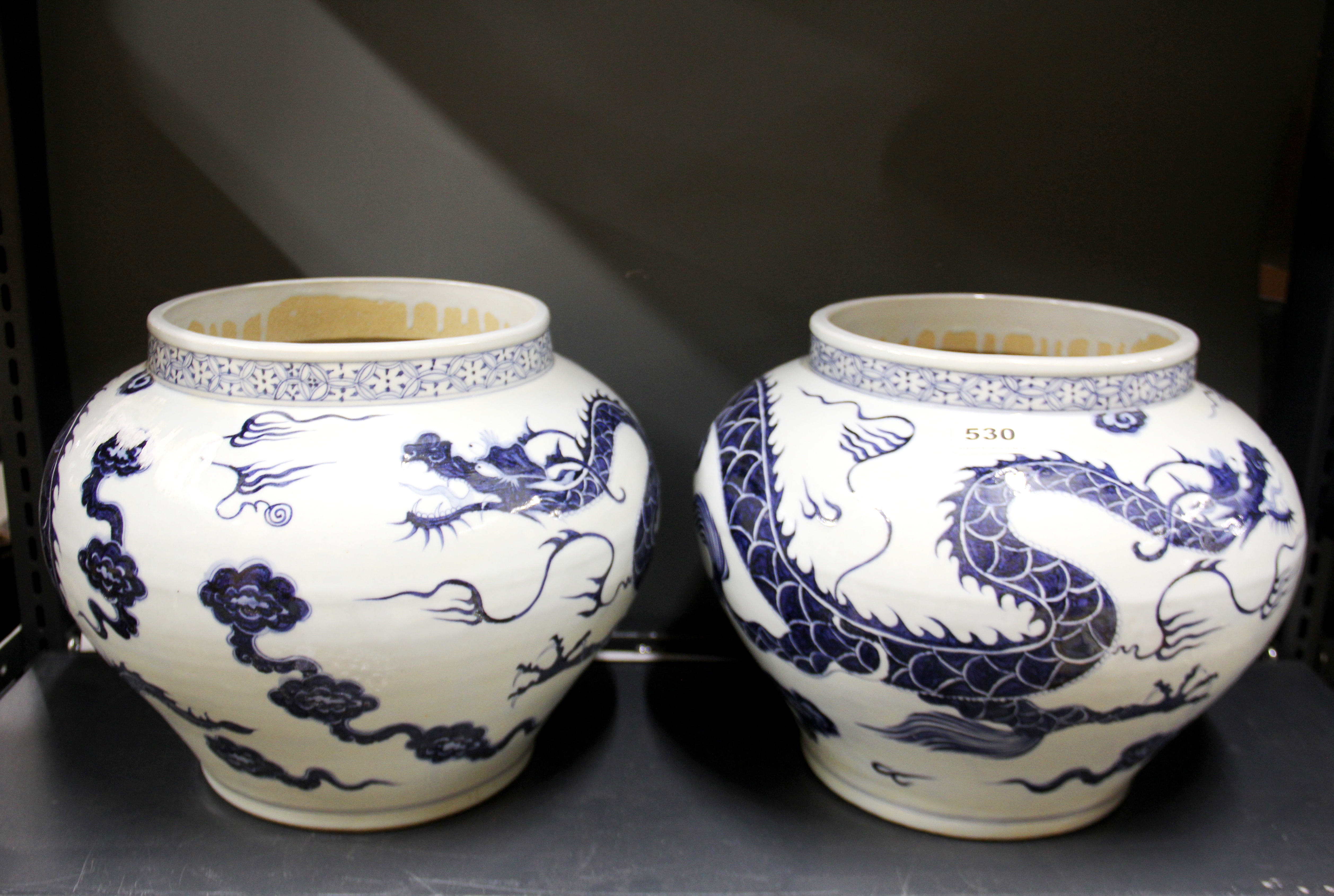 A pair of Chinese hand painted porcelain dragon bowls, Dia. 35cm.