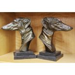 A pair of Art Deco style bronze dog head bookends, H. 21cm.