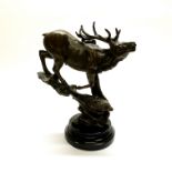 An impressive bronze stag on a marble base. H. 29cm