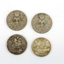 A group of four silver coins.