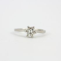 An 18ct gold and platinum solitaire ring set with a large brilliant cut diamond, approx. 0.76ct,