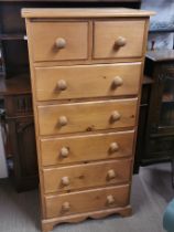 A seven drawer pine chest, 140 x 67 x 45cm.