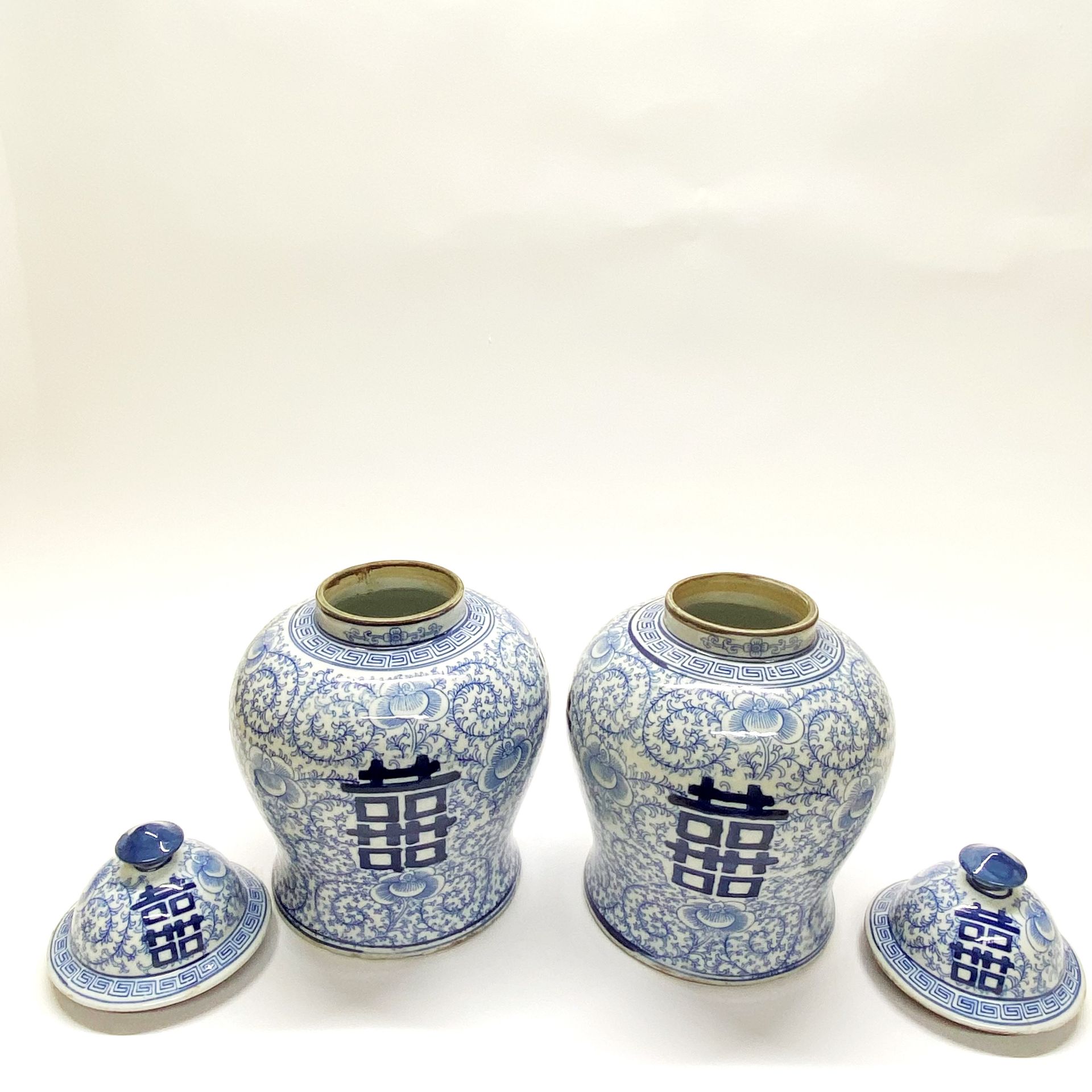 A pair of Chinese hand painted porcelain jars and lids featuring the character for double - Image 2 of 3