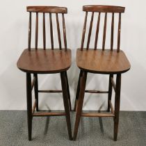 A pair of wood and laminate spindle back high chairs, H. 101cm.