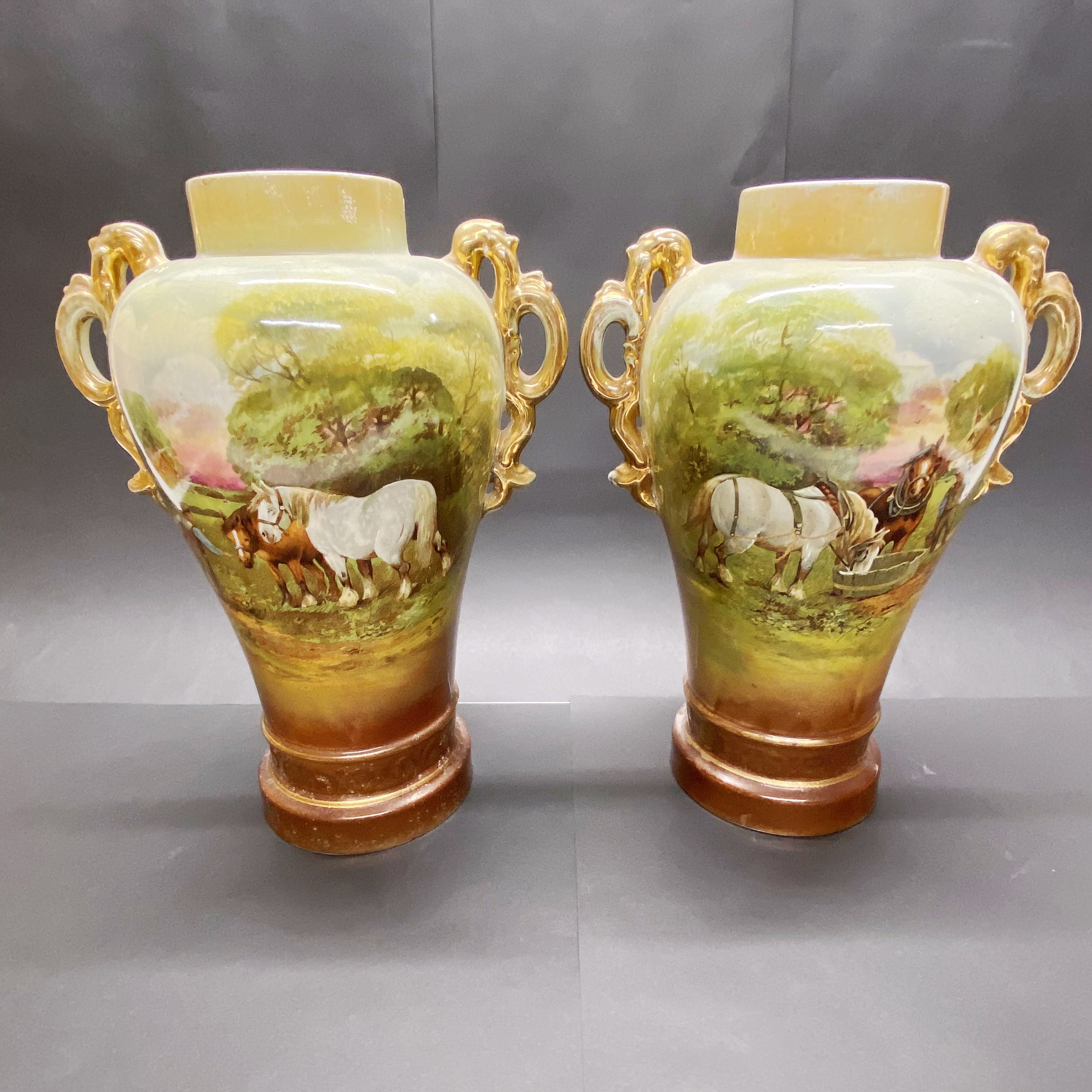 A pair of early 20thC ceramic vases H. 35cm.