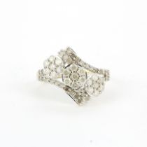 A 10ct yellow and white gold (marked 10K) diamond set ring, (O).