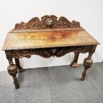 A 19thC finely carved oak hall table/ sideboard, 122 x 100 x 48cm.