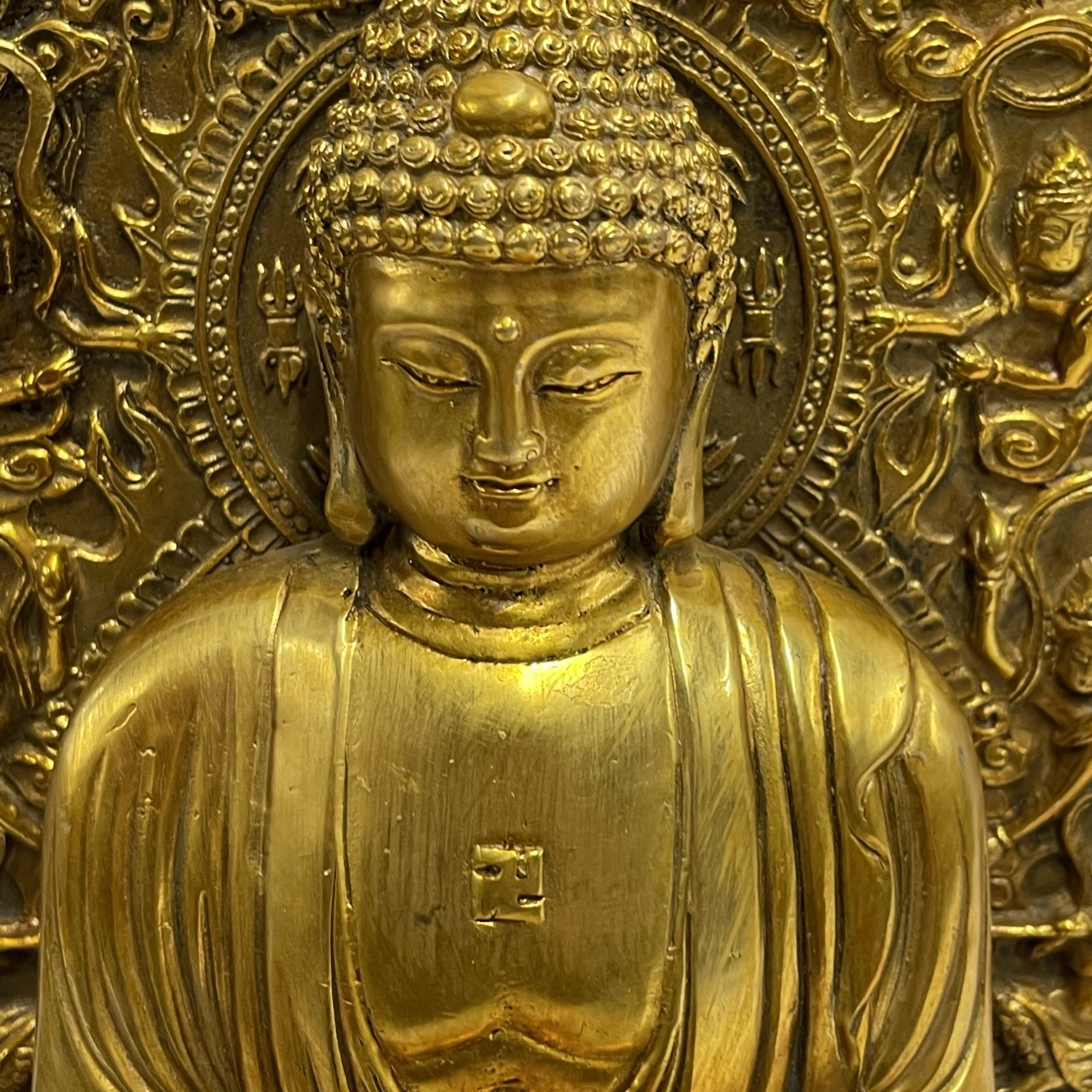 A tibetan gilt bronze figure of a seated Buddha H. 36cm. - Image 2 of 3