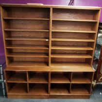 A pair of large oak two section bookshelves, 215 x 100 x 47cm.