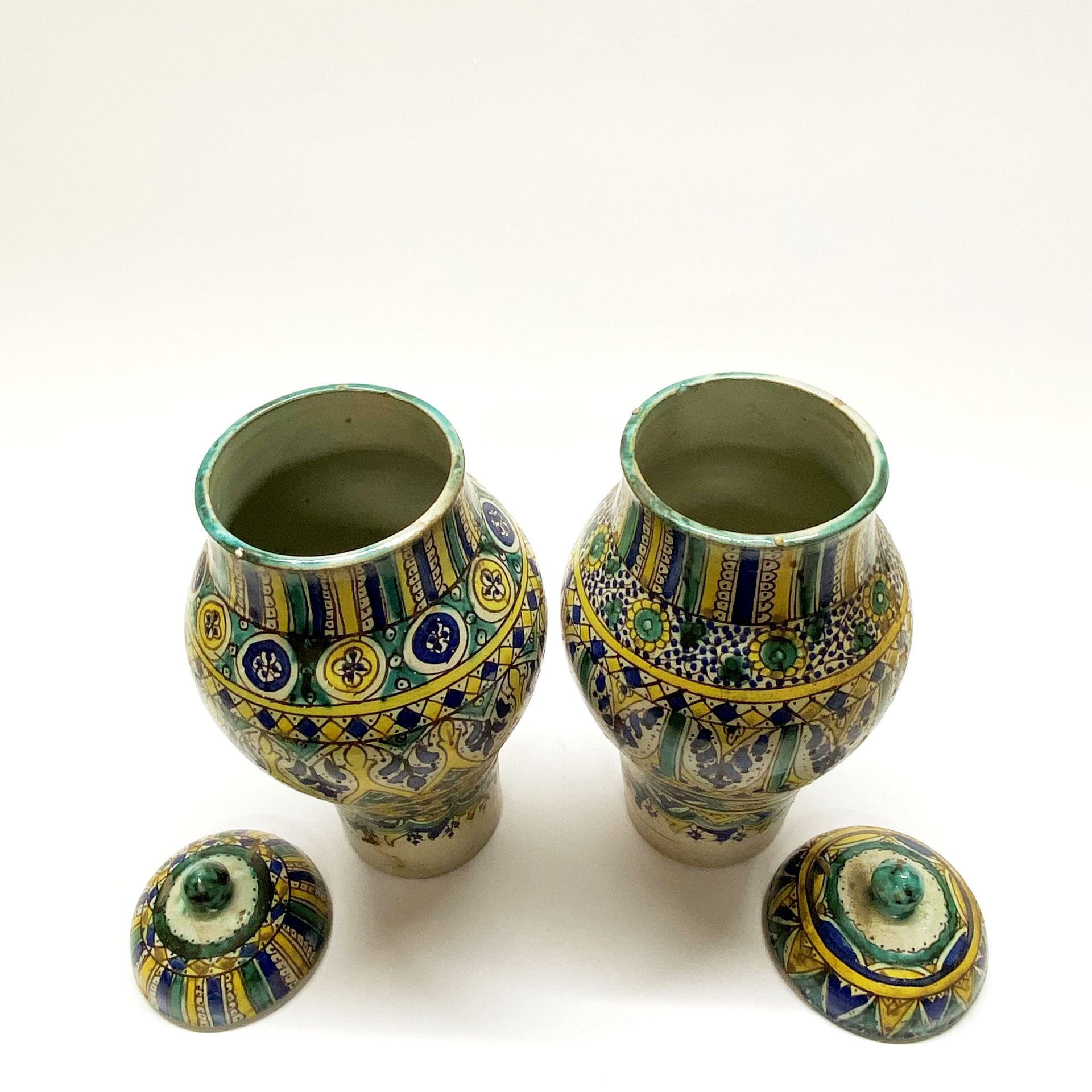 A pair of 19th/early 20thC eastern hand painted pottery jars and lids. H. 39cm (A/F) - Image 2 of 2