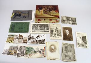 A group of WWI and other postcards including Bairnsfather and a Japanese album of tinted