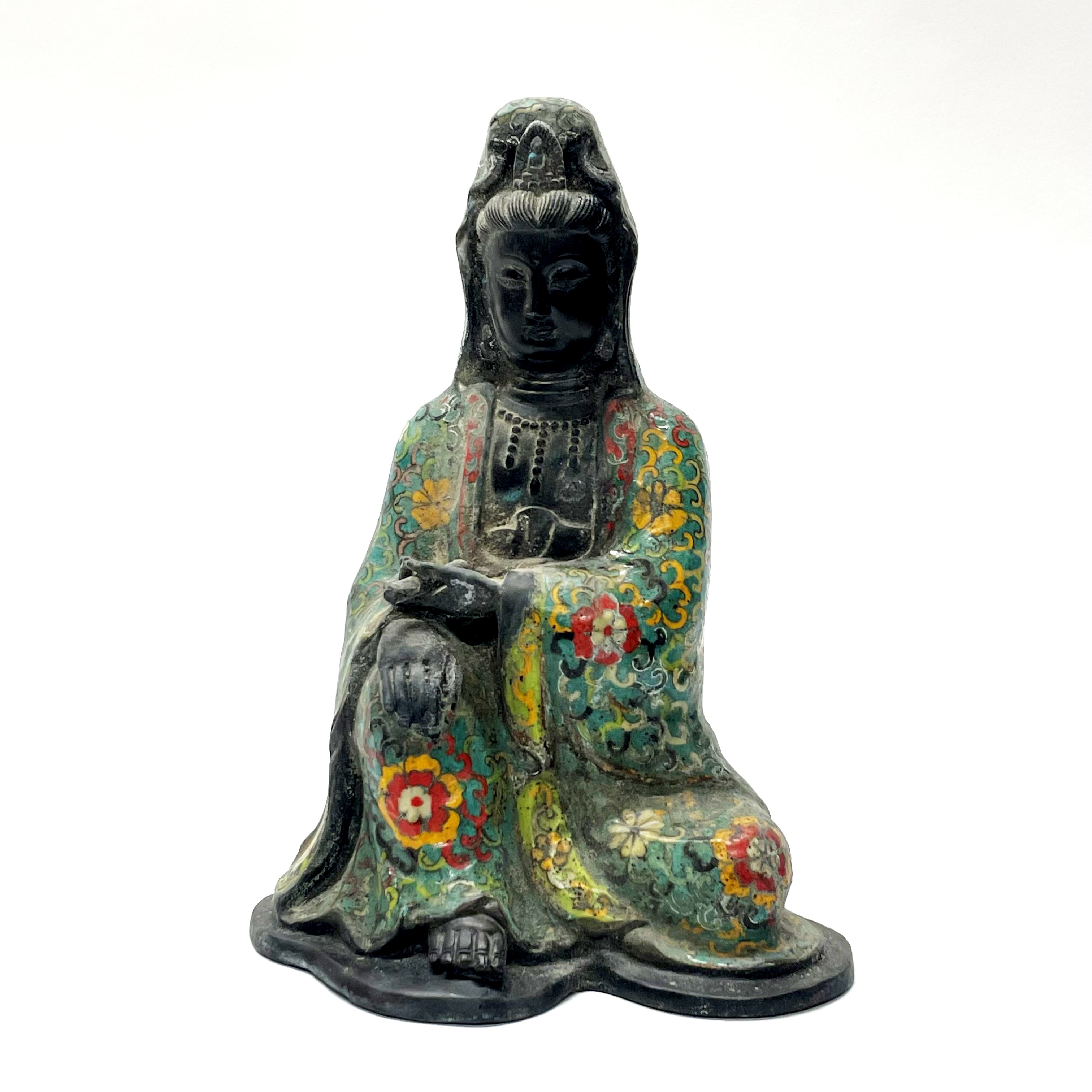 A Chinese enamelled bronze figure of a seated goddess Guanyin H. 30cm