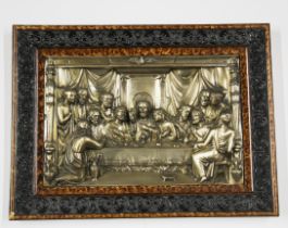 A framed metal relief panel of The Last Supper, frame size. 59cm x 45cm.