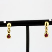 A pair of 18ct yellow gold ruby and diamond set earrings, L. 1.2cm.