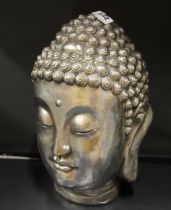 A silvered composition Buddha head, H. 36cm.