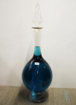 A very large glass window display bottle containing a blue liquid, H. 91cm.