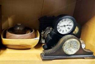 A group of mixed clocks and wooden bowls.