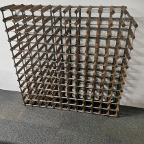 A wood and metal 124 bottle wine rack, 120 x 120cm. A/F to one corner.