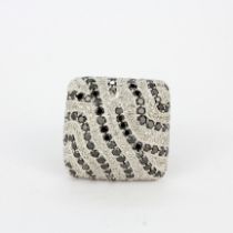 A heavy 14ct white gold square faced ring set with black and white diamonds, (O.5).