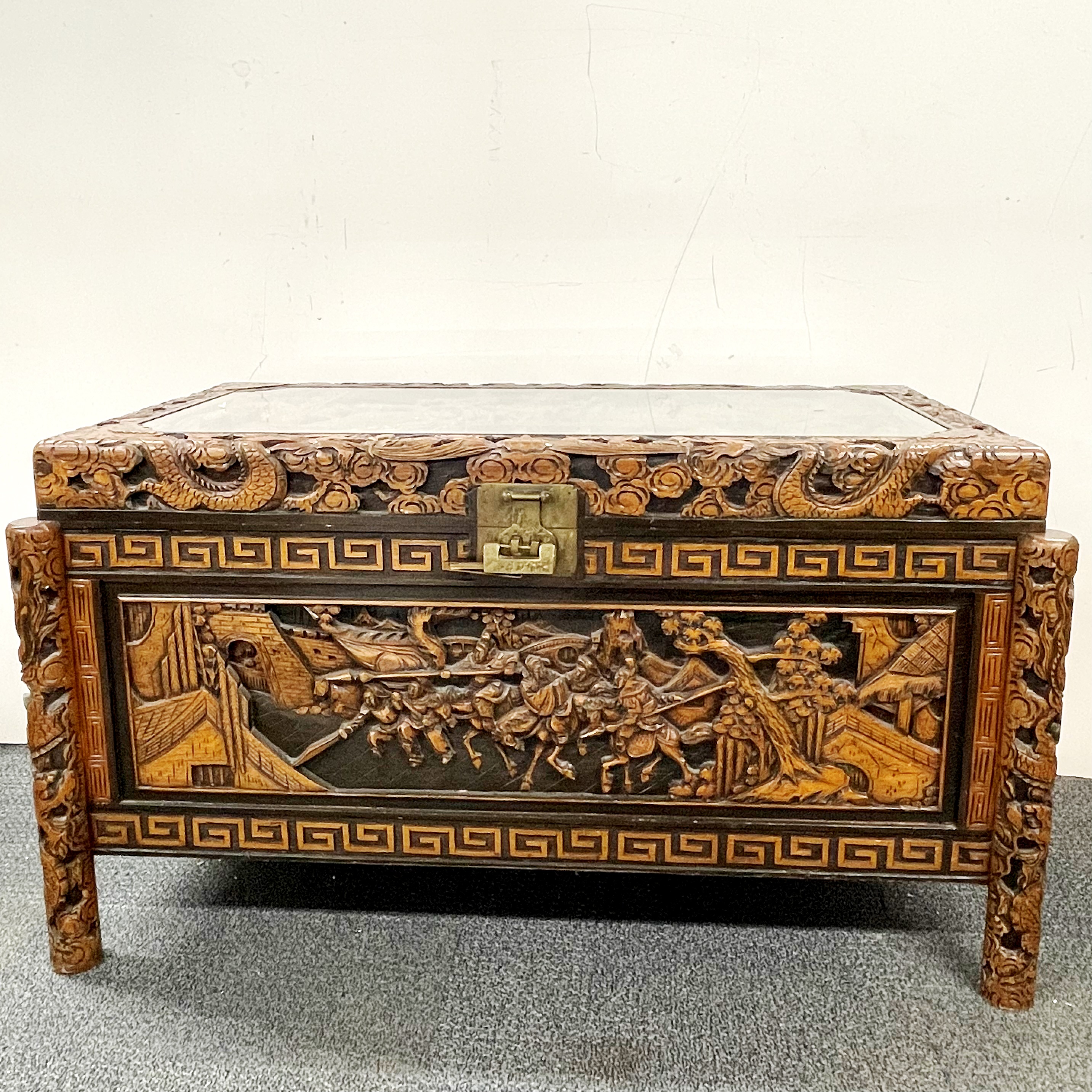 A large oriental camphor lined carved hardwood linen chest S. 106 x 57cm x 59cm with protected glass