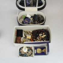 A jewellery case and contents with a further box of jewellery.