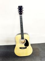 A Falcon acoustic guitar.