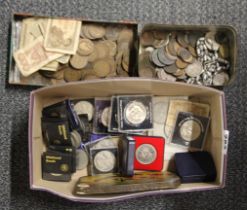 A box of pennies and other old coins.