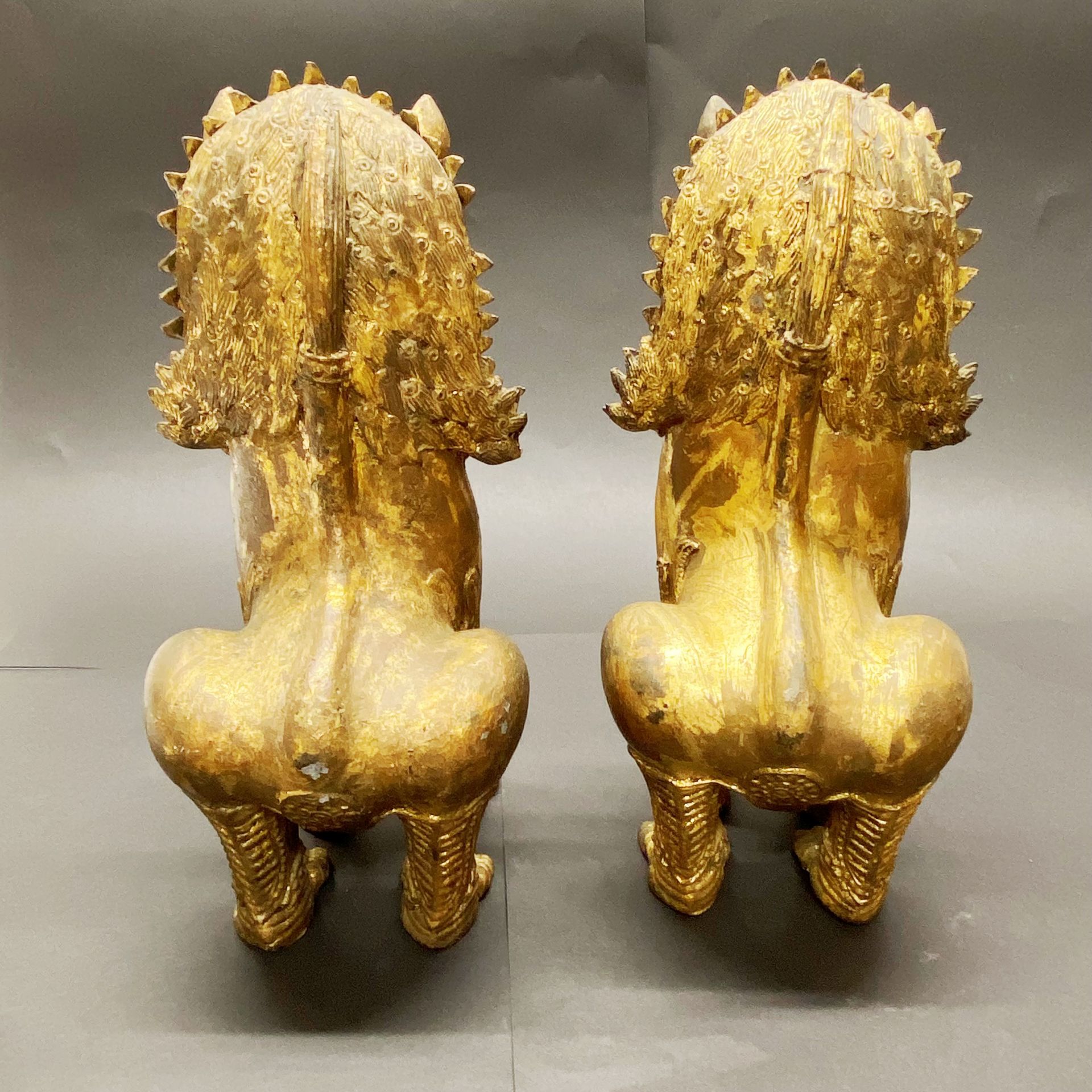 A pair of 19th/20thC Burmese gilt bronze figures of temple lions H. 28cm - Image 4 of 4