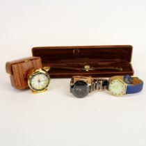 Four vintage watches including Anna Bella and a travelling clock.