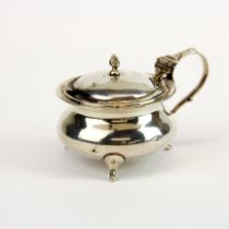 A heavy hallmarked silver mustard pot with blue glass liner W. 9cm