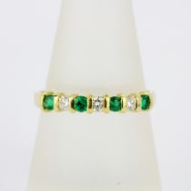 An 18ct yellow gold half eternity ring set with brilliant cut diamonds and emeralds, (O.5).
