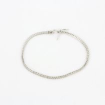 An 18ct white gold tennis bracelet set with brilliant cut diamonds, approx. 2.35ct total, colour G-