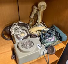 Five vintage telephones.