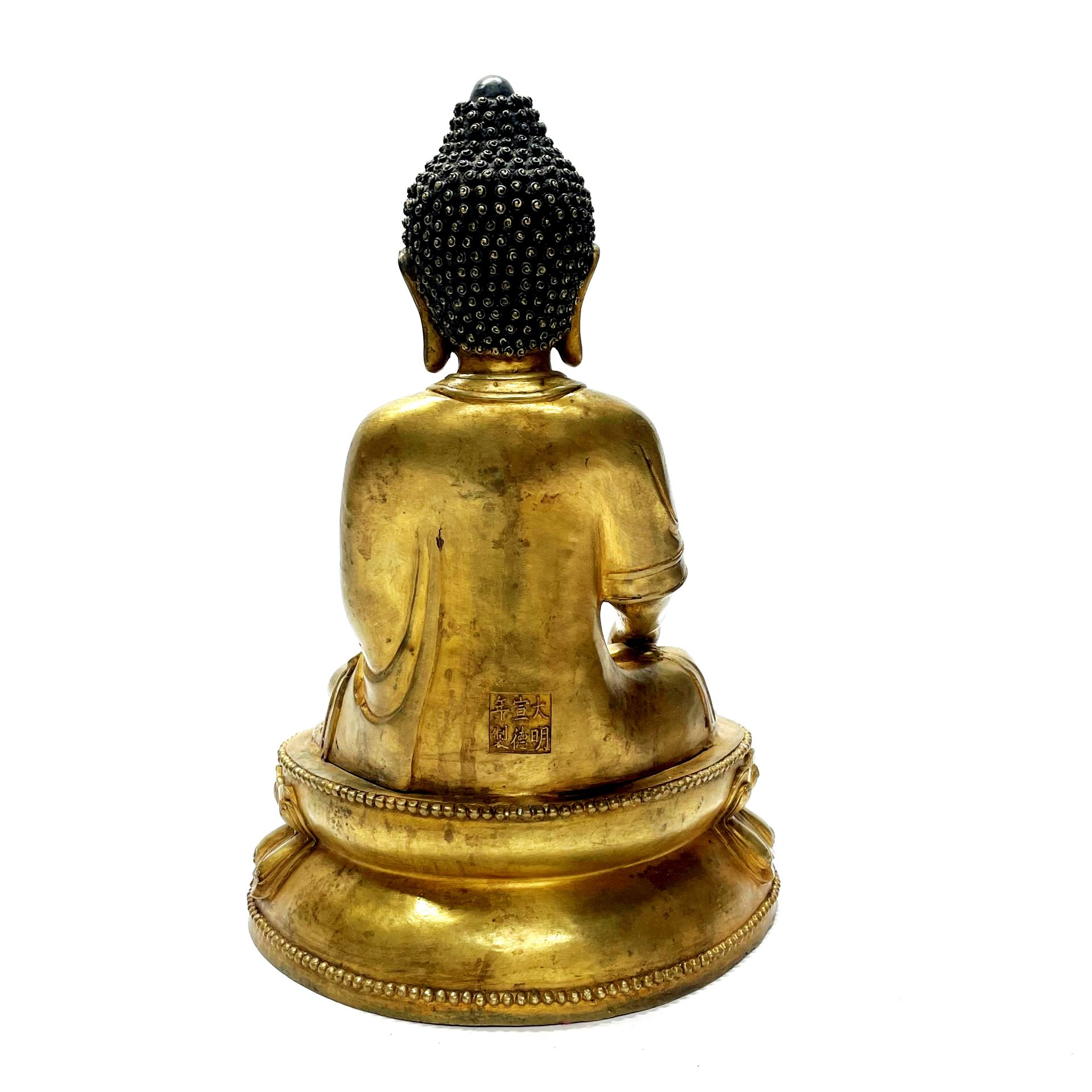 A Sino-Tibetan gilt bronze figure of a seated Buddha H. 38cm - Image 2 of 3