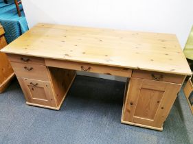 A pine kneehole writing desk, 152 x 75 x 66cm.