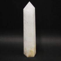 A large polished quartz crystal point, H. 30cm.