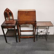 A small oak single drawer bureau, together with an oak and iron magazine rack, a further two tier