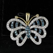 A 10ct yellow gold blue and white diamond set butterfly pendant, 2.5cm.