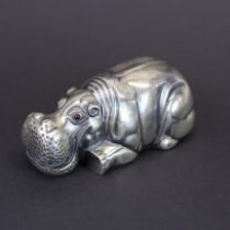 A Russian .84 silver model of a hippo with ruby eyes, L. 8cm.