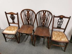A pair of spindle back oak dining/hall chairs, H. 89cm together with a pair of inlaid mahogany