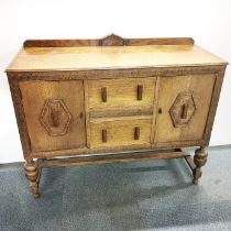 A carved oak two drawer sideboard, 120 x 100 x 45cm.