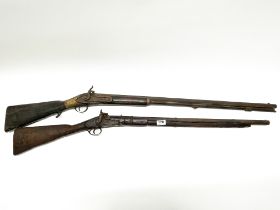 A 19thC rifle in overall poor condition, together with a similar rifle. Longest. 120cm.