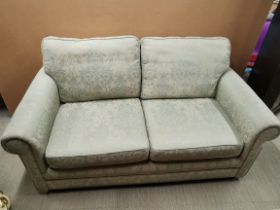 A green floral upholstered two seater settee/ sofa, L. 170cm H. 90cm D. 90cm.