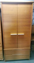 A John Lewis wooden veneered wardrobe with two drawers and metal handles, 205 x 100 x 58cm.